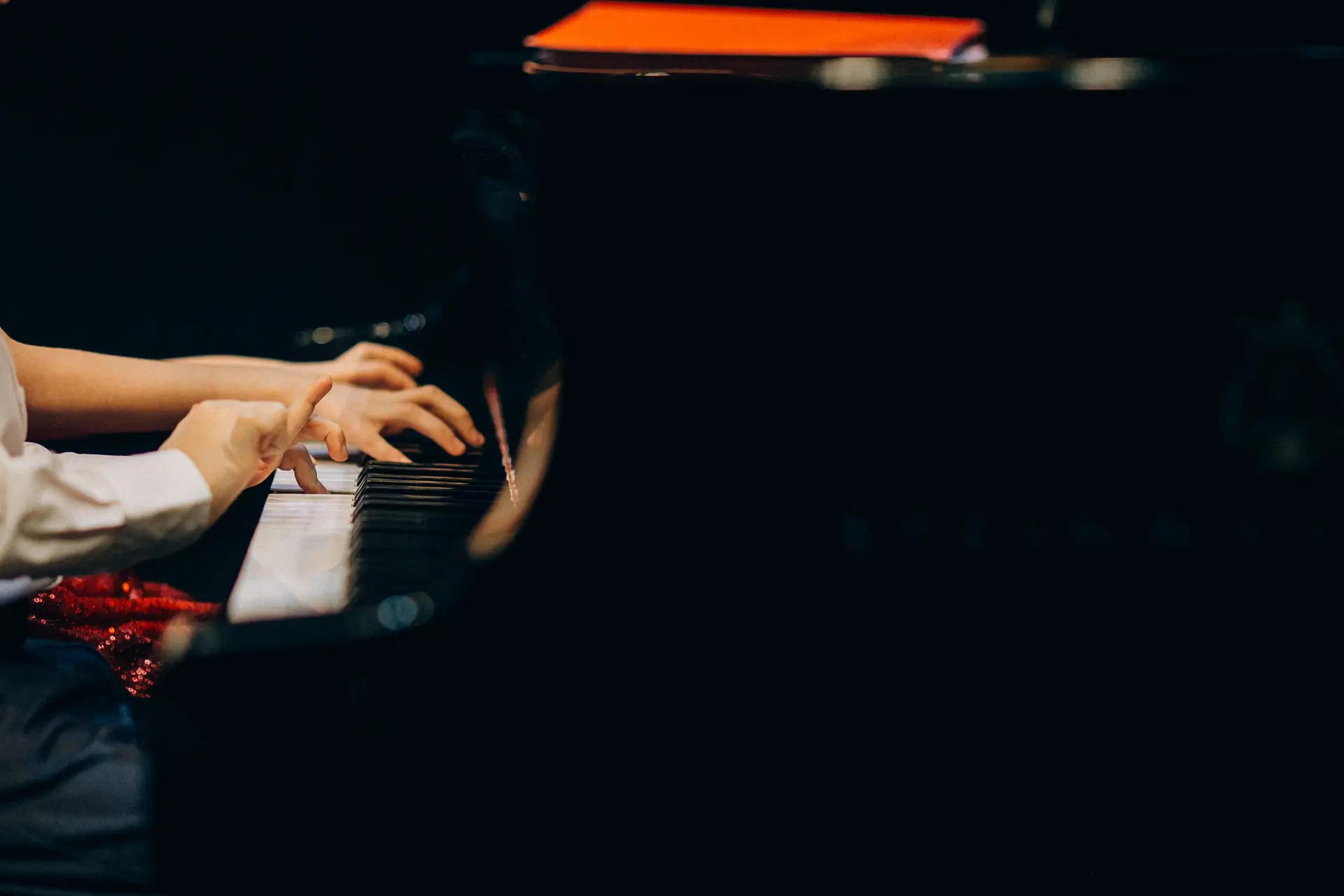 Hands playing piano